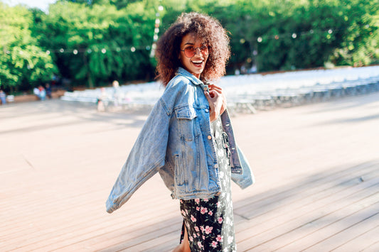 Women in jean jacket smiling